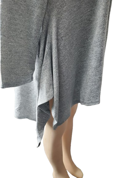 Gray knit top on a mannequin against a white background