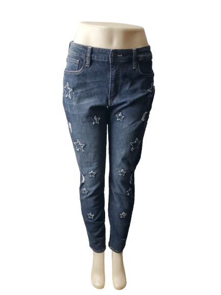 Blue jeans with star patterns on a mannequin against a white background