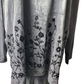 Gray fabric with black floral embroidery on a white background
