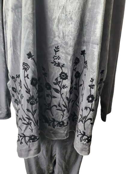 Gray fabric with black floral embroidery on a white background