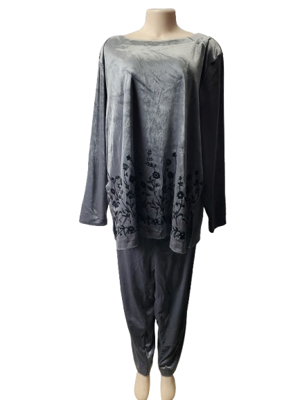 Mannequin wearing a gray outfit with floral embroidery on a white background