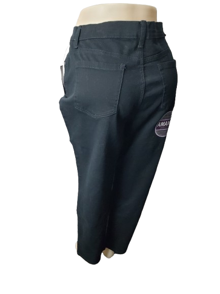 black jeans pants on a mannequin with a visible brand logo against a white background