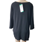 Black sweater on a mannequin with a visible tag against a white background