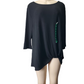 Black top with green embellishment on a mannequin against a white background
