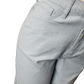 Close-up of light gray pants on a white background