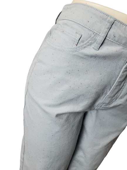 Close-up of light gray pants on a white background