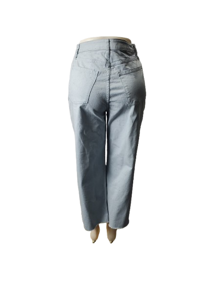 Light blue jeans on a mannequin against a white background