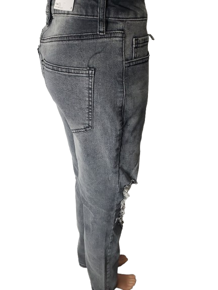 Gray distressed jeans on a white background