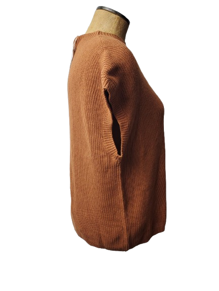 Brown sweater on a mannequin against a white background