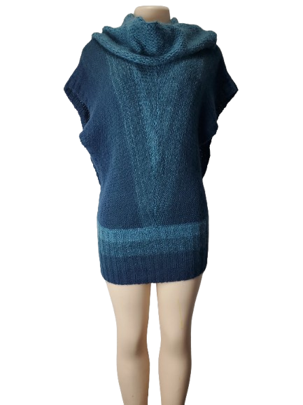 Blue knitted poncho on a mannequin against a white background