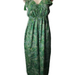 Green patterned dress on a mannequin against a white background