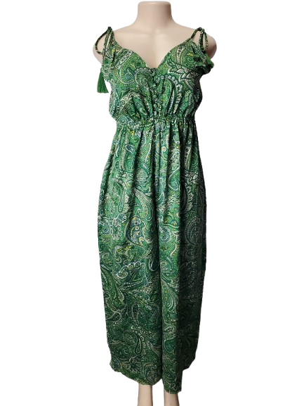 Green patterned dress on a mannequin against a white background