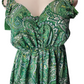 Green paisley patterned dress on a mannequin with a white background