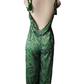 Green paisley patterned jumpsuit on a mannequin against a white background