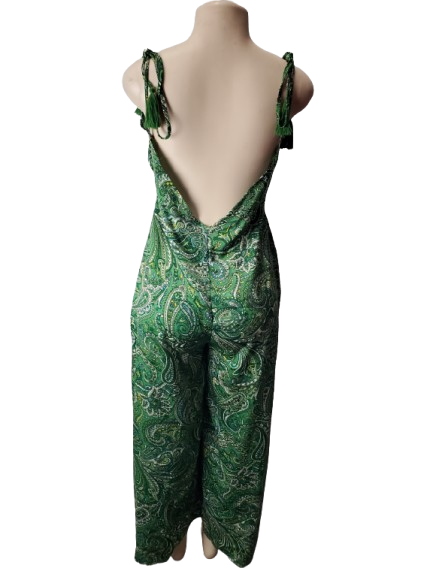 Green paisley patterned jumpsuit on a mannequin against a white background