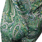 Green paisley patterned fabric on a white background