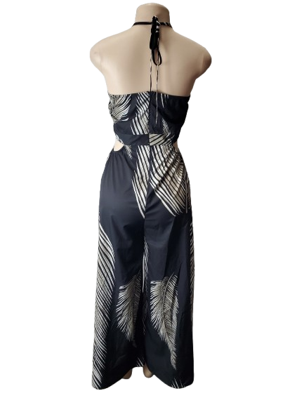 Black and white patterned dress on a mannequin against a white background