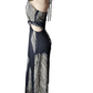 Black and white patterned dress on a mannequin against a white background