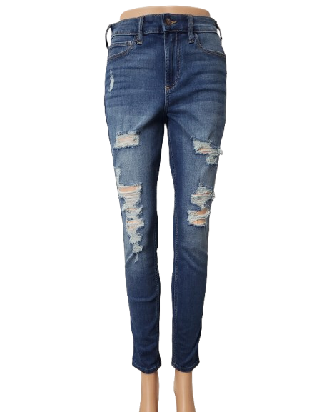 Distressed blue jeans on a white background
