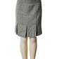 Gray houndstooth patterned skirt on a mannequin against a white background