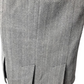 Close-up of a gray and white herringbone patterned skirt.