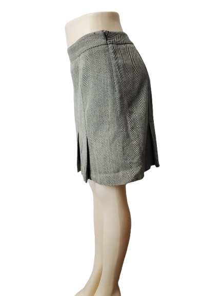 Gray checkered skirt on a mannequin against a white background