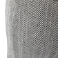 Close-up of a patterned fabric with black and white zigzag design.