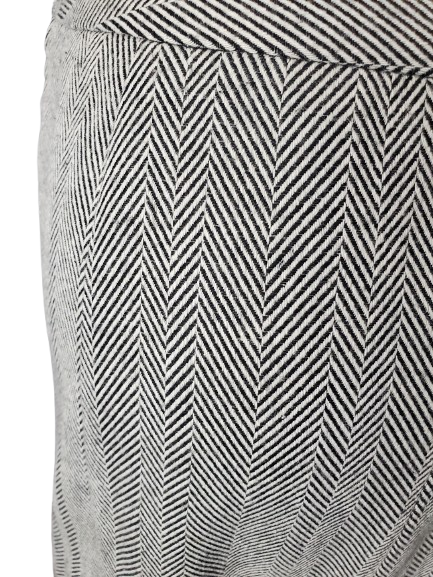 Close-up of a patterned fabric with black and white zigzag design.