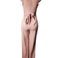 Pink lace jumpsuit on a mannequin against a white background