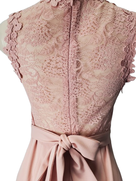 Pink lace top with a bow on a white background