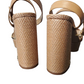 Pair of beige sandals with woven cylindrical platforms on a white background
