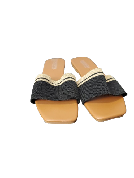 Pair of black and beige sandals on a white background