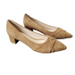 Pair of beige suede shoes on a white background