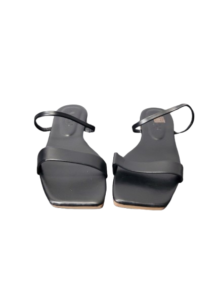 Pair of black sandals on a white background