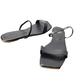 Pair of black sandals on a white background