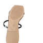 tan sole of a shoe with a black insole on a white background