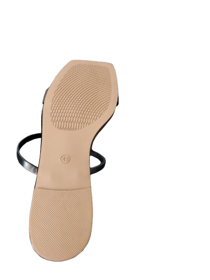 tan sole of a shoe with a black insole on a white background
