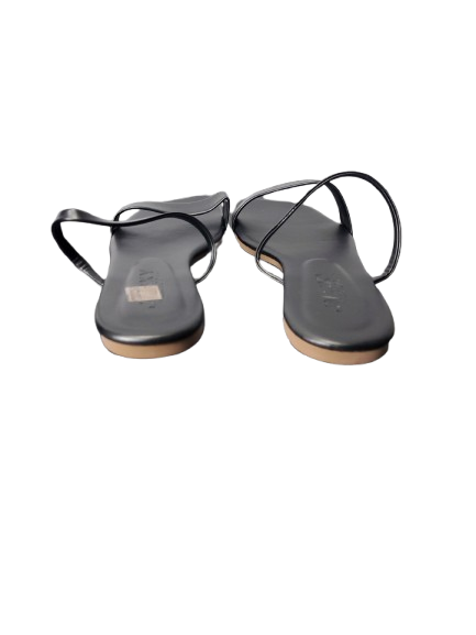 Pair of black sandals on a white background
