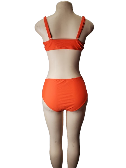 Orange bikini set on a mannequin against a white background