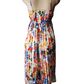 Colorful floral dress on a mannequin against a white background