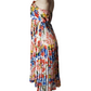 Mannequin wearing a colorful floral dress on a white background