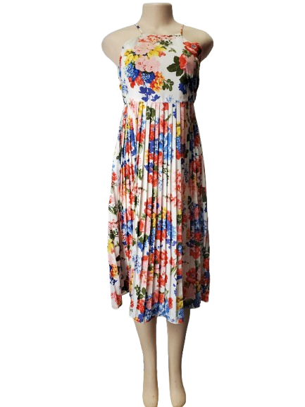 Colorful floral dress on a mannequin against a white background