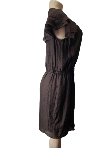 Brown dress on a mannequin against a white background