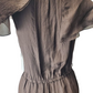 Brown dress on a mannequin against a white background