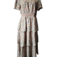 Floral dress on a mannequin against a white background