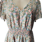 Floral dress on a mannequin with a white background