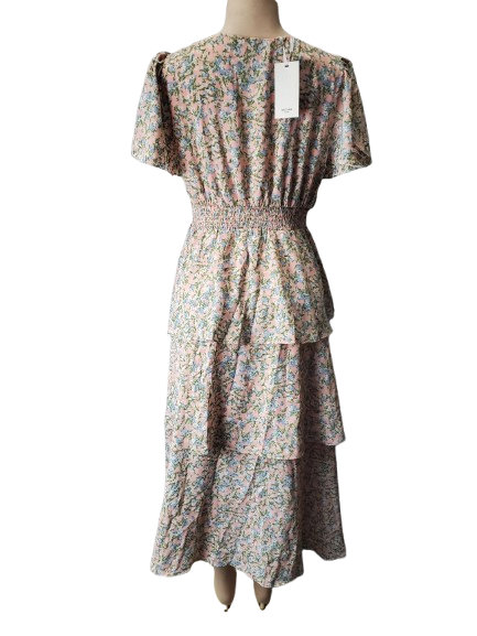 Floral dress on a mannequin with a white background