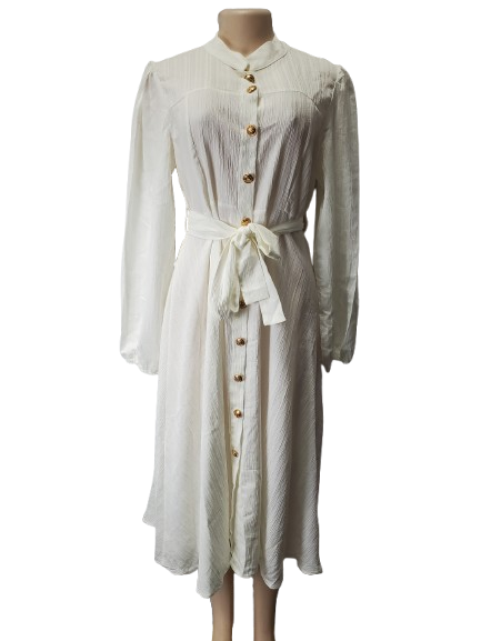 White dress with buttons on a mannequin against a white background