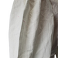 Close-up of a textured fabric with a neutral color palette on a white background