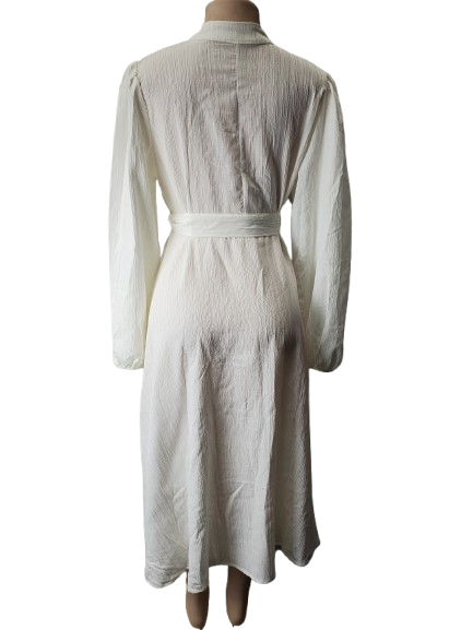 cream long dress with gold buttons
